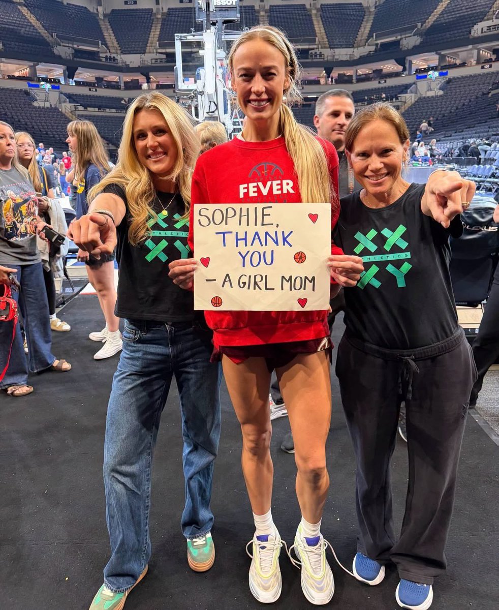 MustangMan_TX's tweet photo. SOPHIE STANDS TALL…  
along with Riley Gaines and Jennifer Sey as they stand up for girls in sports!

Sophie Cunningham posed with Riley Gaines and Jennifer Sey, founder of XX-XY Athletics, after being booed during the Fever’s game against Minnesota.

While the opposing coach wore a “Trans Kids Belong” shirt, Sophie continued standing for girls and women having a fair and protected space to compete.