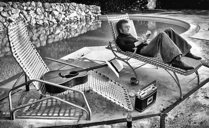 crockpics's tweet photo. John Lennon relaxing by the pool at his rented home in Los Angeles in late 1973. Kicking off his famous 18-month Lost Weekend era during the release of Mind Games, John was surrounded by pure creative essentials—an acoustic guitar resting on the lounge chair, a portable tape player, a fedora, and a book. Photo by Michael Brennan 

When you look back at John Lennon’s post-Beatles solo catalog, which song or album stands out as your absolute favorite? 👇️
