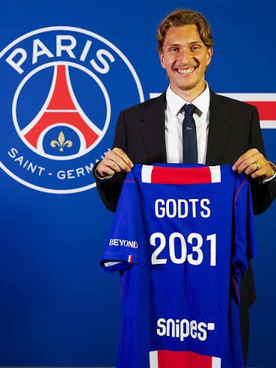 crypto_doings0's tweet photo. Mika Godts, a 21-year-old Belgian forward, has joined Paris Saint-Germain on a contract until 2031. He came through Anderlecht and Genk, shone at Ajax with goals and assists, and already has caps for Belgium. Known for his dribbling and attacking flair, he’ll wear the number 22. https://t.co/EBhLJ9s7dq