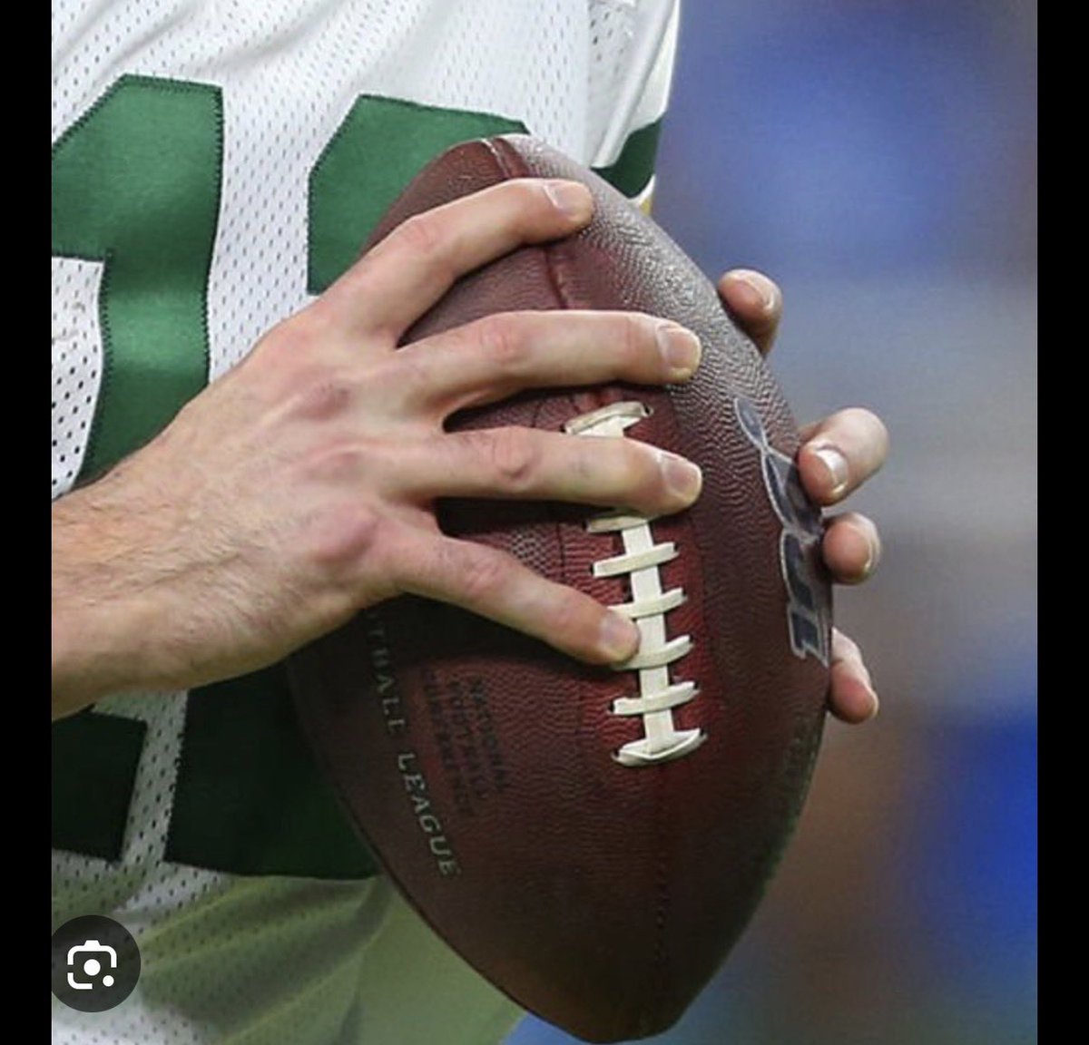KurtBenkert's tweet photo. I figured out why Shedeur throws wobblers and why that ball slipped out of his hands on his INT across the middle the other day.

He doesn’t hold the ball right, and it’s a simple fix.

People hold the laces differently but his pointer finger on the tip of the ball doesn’t allow him to wrap and rotate the ball.

He ends up throwing it more like a javelin than ripping / spinning the ball. It’s why it wobbles often.

I believe if he slid his pointer down to wrap the ball it would slightly cock the ball more to 90 degrees on his release and give him more RPMs and grip.

His angle is slightly off and it starts with the pointer finger. It might help him to slide down 1 lace too.