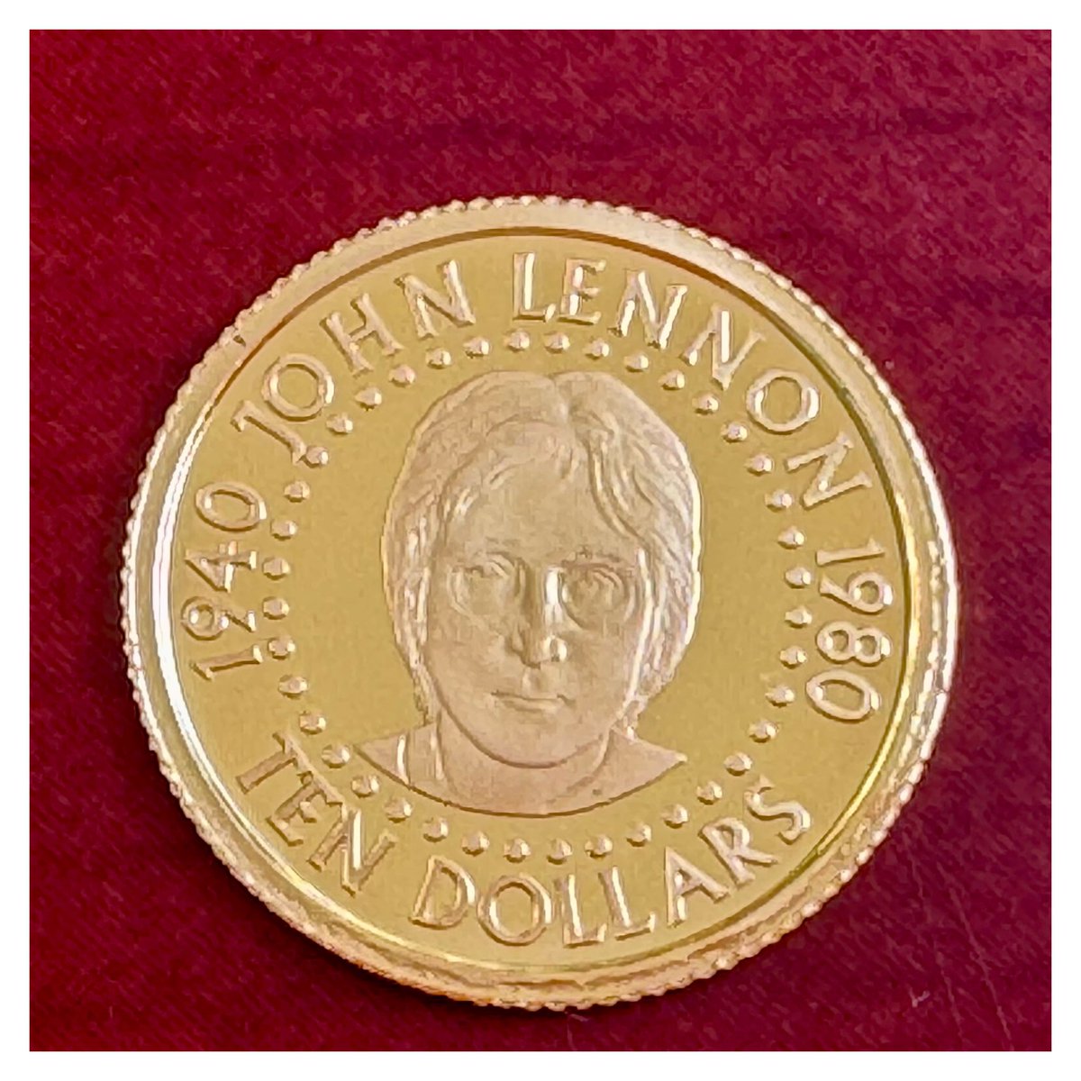 hopeagold's tweet photo. First in my 25 coin series for a full gold ounce: a Solomon Islands 10 Dollars, struck in 2005 for the 25th anniversary of John Lennon's death. 1.24 grams of fine gold, honoring an icon of music and peace, gone from the world at just 40 years old.#FractionalGold #JohnLennon https://t.co/qEkmiUu3ZH