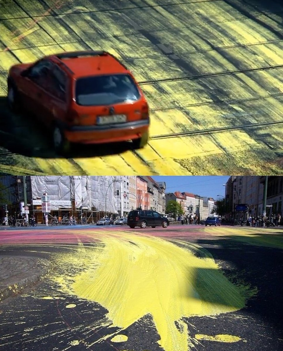historyinmemes's tweet photo. In the early hours of an April morning in Berlin, artist IEPE and a group of collaborators transformed an ordinary intersection at Rosenthaler Platz into something completely unexpected.

Arriving by bicycle with buckets of brightly colored, water-based paint, they poured the colors across the asphalt before disappearing into the city. What happened next became part of the artwork as cars, bicycles, and pedestrians moved through the paint, constantly spreading and reshaping the colors.

The temporary installation turned the street into an ever-changing canvas, created by both the artists and the people passing through it. The non-toxic paint eventually washed away with the rain, but for a few hours, ordinary city life became a spontaneous act of collective art.