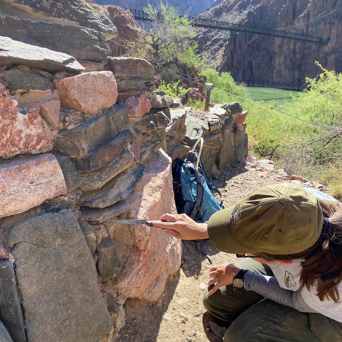 GrandCanyonNPS's tweet photo. On this day, August 16, in 1869, Members of the Powell Expedition (the first scientific and mapping expedition through Grand Canyon by boat), had reached Bright Angel Creek and decided to spend a day to "rest and repair". They repaired damage to their boats and made some new oars.

Bright Angel Campground, and Phantom Ranch are located here today. (Colorado River mile 88). 

John Wesley Powell writes. "Early in the morning the whole party starts up to explore the Bright Angel River, with the special purpose of seeking timber from which to make oars. 

"A couple of miles above we find a large pine log, which has been floated down from the plateau, probably from an altitude of more than 6,000 feet, but not many miles back. On its way it must have passed over many cataracts and falls, for it bears scars in evidence of the rough usage which it has received. The men roll it on skids, and the work of sawing oars is commenced.

"This stream heads away back under a line of abrupt cliffs that terminates the plateau, and tumbles down more than 4,000 feet in the first mile or two of its course; then runs through a deep, narrow canyon until it reaches the river. 

"Late in the afternoon I return and go up a little gulch just above this creek, about 200 yards from camp, and discover the ruins of two or three old houses, which were originally of stone laid in mortar. Only the foundations are left, but irregular blocks, of which the houses were constructed, lie scattered about. 

"In one room I find an old mealing-stone, deeply worn, as if it had been much used. A great deal of pottery is strewn around, and old trails, which in some places are deeply worn into the rocks, are seen."  —John Wesley Powell

How does the park balance interpreting the past while also protecting it? The site that Powell examined, the Bright Angel Pueblo site, was occupied over 900 years ago by Ancestral Puebloan families who built the structures using local soil and rock. 

Today's park archaeologists, using a mud mortar, fill holes, replace eroded mortar, and reset loose stones in the walls while taking care to visually match the work of the original builders. This periodic maintenance ensures the walls remain stable and the site is preserved for future generations to experience.
 
You can help protect sensitive cultural resources by respecting closures, staying on designated trails, viewing sites from a distance, and leaving artifacts where you find them. 

Learn more about Grand Canyon's Vanishing Treasures program on our website > https://t.co/ZYGbJMU0zD (1105)

Grand Canyon National Park is located in an area rich in Indigenous history and culture. There are 11 present day tribes that have long-standing cultural ties with the Grand Canyon: the Havasupai, Hopi and Hualapai tribes, the Navajo and Yavapai Apache nations, the Pueblo of Zuni and the Southern Paiute including the Kaibab, Las Vegas and Moapa bands of Paiute Indians, the Paiute Indian Tribe of Utah and the San Juan Southern Paiute Tribe. 

In recent years, the park has been working closely with local Indigenous leaders to incorporate their perspectives into park management and visitor education. This collaboration helps to ensure that the cultural significance of the land is respected and preserved.

#GrandCanyon #Arizona #Archeology #ArcheologyLife #Archaelogy #ColoradoRiver #History #HistoryMatters #PowellExpedition #GrandCanyonNationalPark #FindYourPark #VanishingTreasures