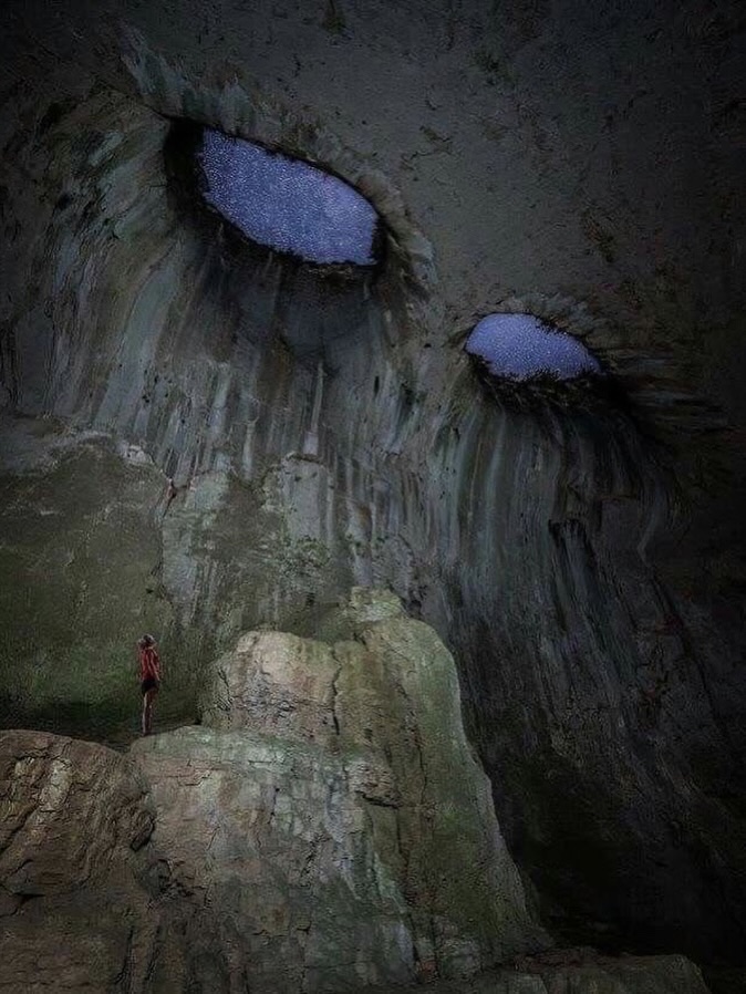historyinmemes's tweet photo. A cave in Bulgaria has earned the nickname “the Eyes of God” because of its striking natural formations.

Deep within Bulgaria’s karst landscape lies Prohodna Cave, known for its two enormous, symmetrical openings in the ceiling. Resembling a pair of eyes, they have earned the cave the nickname “The Eyes of God.”

During the day, sunlight streams through the natural skylights, while at night, they can frame the moon and stars above. The unusual geological formation creates a striking atmosphere that continues to draw visitors today.