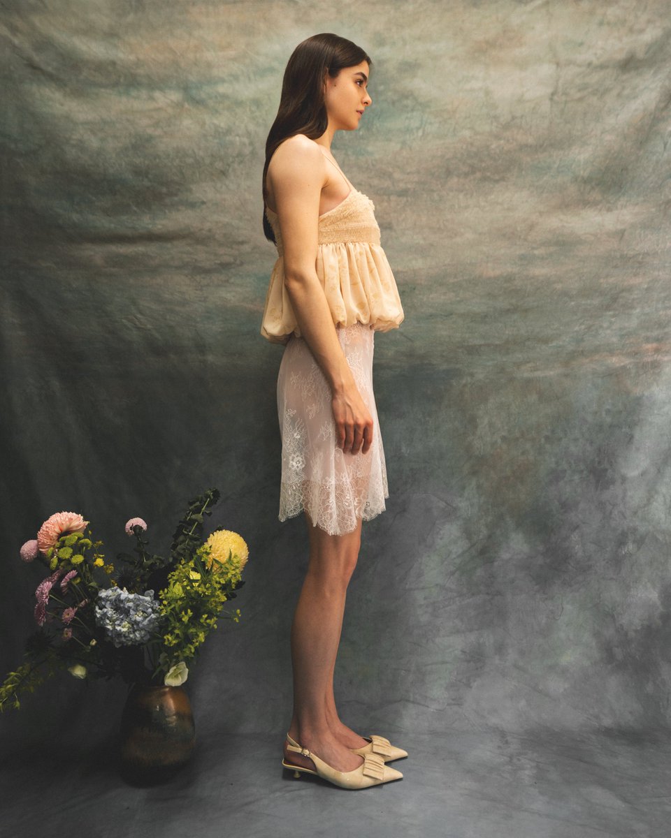 claudiacloudyah's tweet photo. Look VII: The Jennitte Blouse features multi-layered hand feathered chiffon strips covering the bust and 1/8” bias straps on a bubble silhouette.

The Ruthe Skirt features hand-cut French Chantilly lace panels.

Discover the collection online. https://t.co/6TSfVzSNu5 https://t.co/cIWFGD1dPJ
