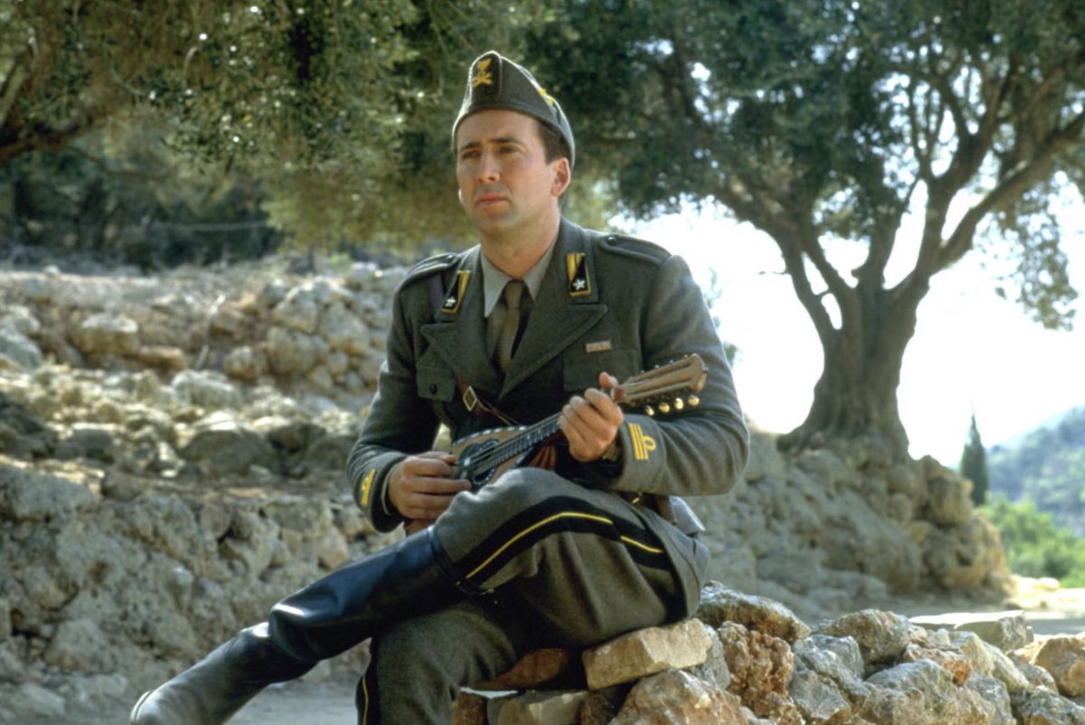 25YearsAgoLive's tweet photo. Captain Corelli’s Mandolin, a new WWII film about the Italian Army starring Nicholas Cage and Penelope Cruz, neither of whom are Italian but both of whom put on campy Italian accents, premieres in theaters. https://t.co/zkPdJ1bmn7