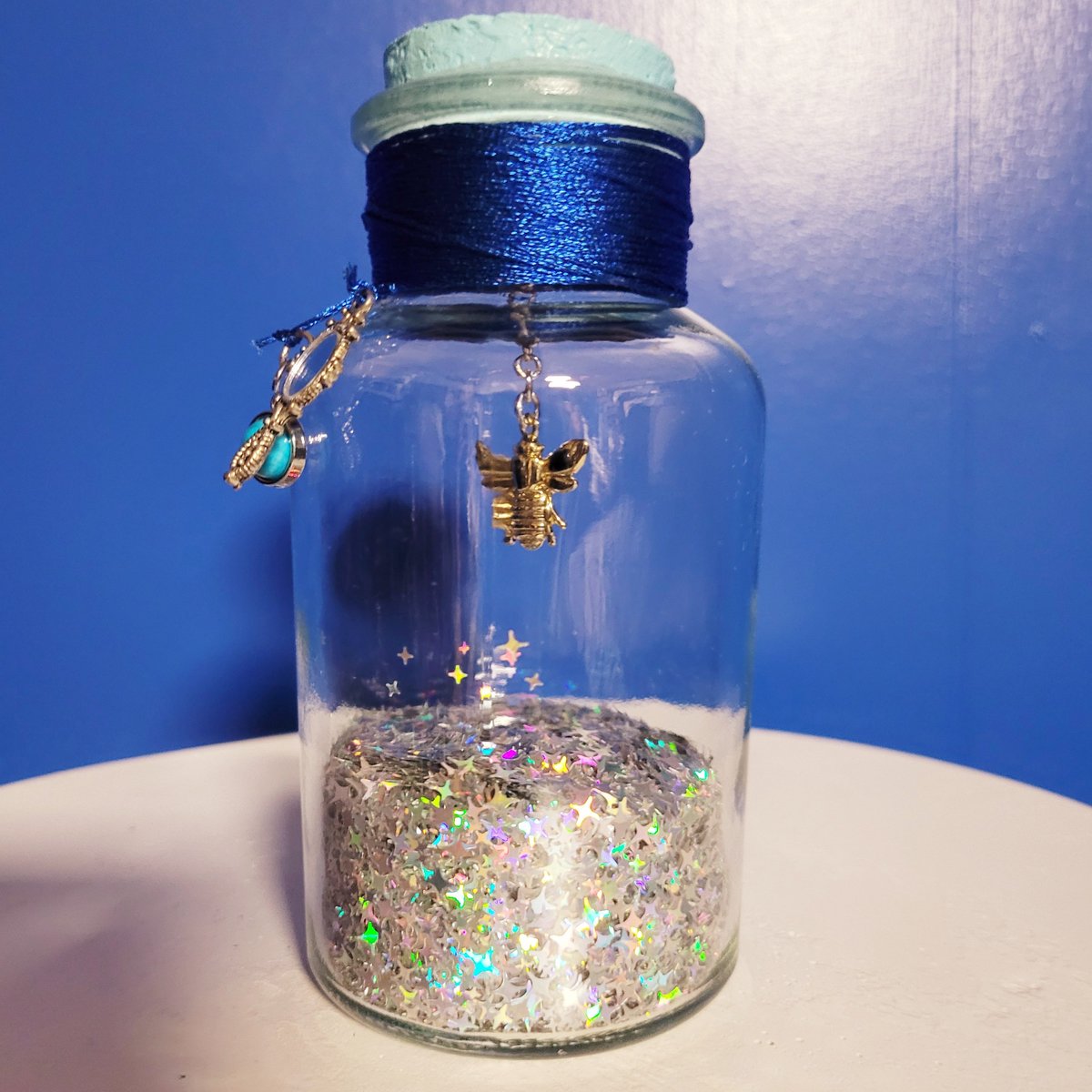 JamesGannonCom's tweet photo. The Bottles of Life 024: Golden Bee- Found within an icy cavern. Normal bees attack you, golden ones attack for you. Includes a magic mirror and a lunar gem to aid in finding yourself and your way home. 🐝🪞🔵🧊 #thebottlesoflife #artsandcrafts #bottle https://t.co/bzmUlMiMbp