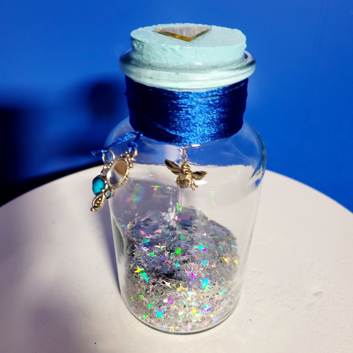 JamesGannonCom's tweet photo. The Bottles of Life 024: Golden Bee- Found within an icy cavern. Normal bees attack you, golden ones attack for you. Includes a magic mirror and a lunar gem to aid in finding yourself and your way home. 🐝🪞🔵🧊 #thebottlesoflife #artsandcrafts #bottle https://t.co/bzmUlMiMbp