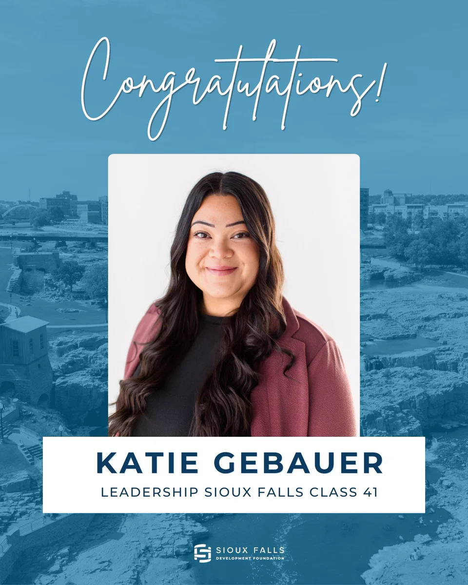 Announcement congratulating Katie Gebauer on selection to Leadership Sioux Falls Class 41, showing a smiling head-and-shoulders portrait of a woman centered on a blue photo background with "Congratulations!" text above and Sioux Falls Development Foundation logo below.