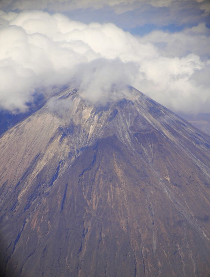 VerySouthWest's tweet photo. @DailyPicTheme2 Ol Doinyo Lengai, meaning "Mountain of God" is an active volcano. Pic taken #FromAbove in a small plane while flying over Tanzania. https://t.co/ZvJZpHkGmy