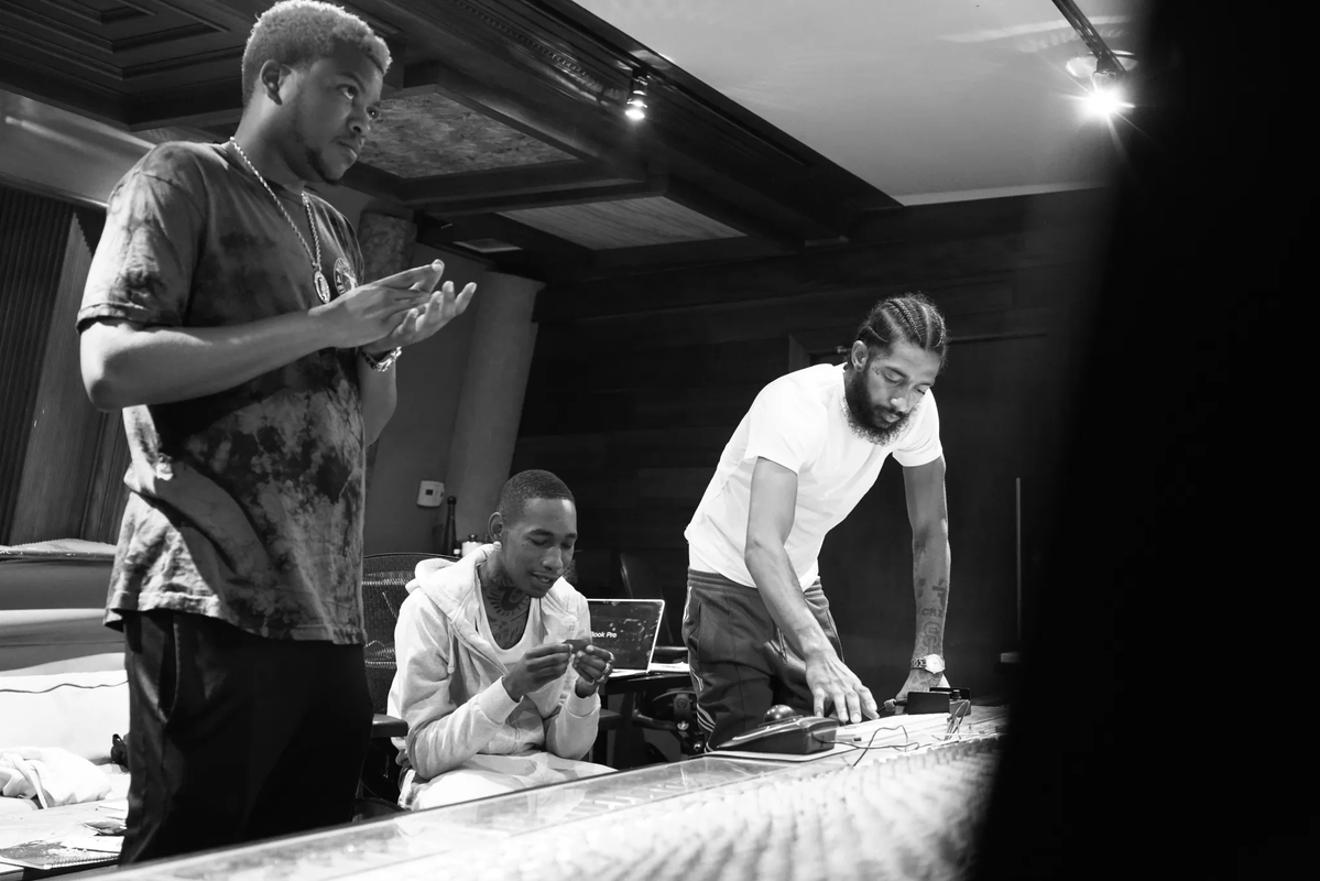 VibeMagazine's tweet photo. .@BinoRideaux on how he first got connected with Nipsey Hussle: 

"I got that call one day off @CaseyVeggies’ phone... Nip pulled up to the studio. It was Nip on Casey’s phone. He’s like, 'Pull up to the studio.' Everything happened after that." 

More: https://t.co/N0dpbeuhSD https://t.co/sJPhx7vybv