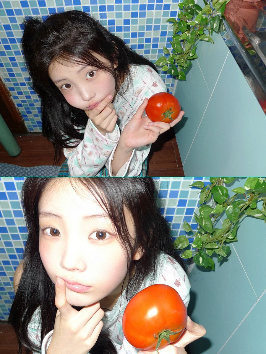 onhwee's tweet photo. i cradle this plump scarlet tomato in my palm, savoring its glossy sheen and fresh garden aroma. resting my chin thoughtfully against my fingers, i tilt my head and lock eyes with the lens in a soft playful gaze. https://t.co/IZm5s1l7AC