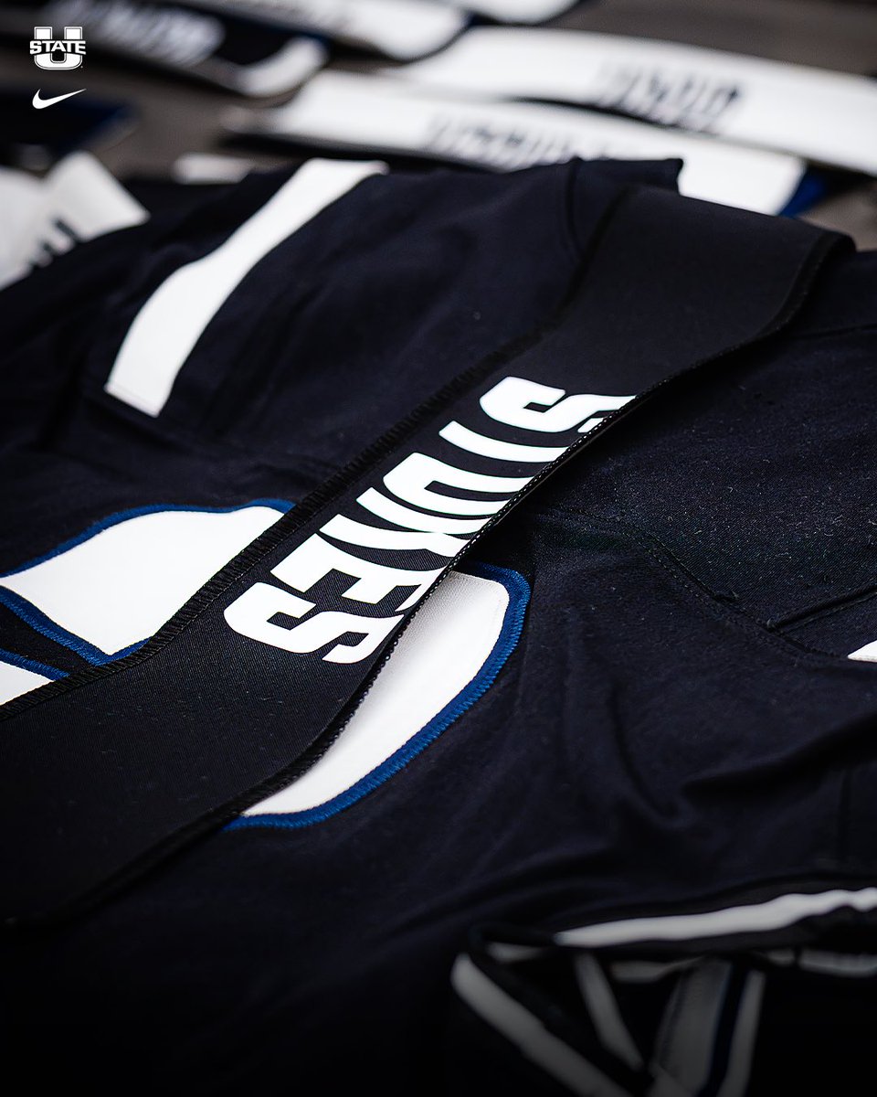 USUFootball's tweet photo. New numbers 🟰 updated unis! 

A huge shoutout to @utahstate_qanr for helping put together our nameplates onto our jerseys with the season coming up! 🪡 🧵 https://t.co/JScB4F3ADI