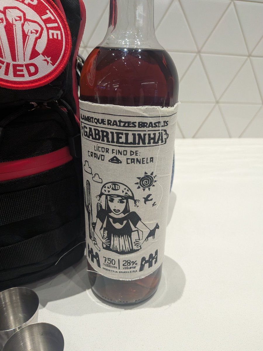 who1sroot's tweet photo. Arrived at #LineCon for #DEFCON34 and brought Brazilian liquor to share!

It's made of cachaça, cinnamon and clove, popularly called "Gabriela, cravo e canela".

You can find me by my bag and shirt, but please be discreet as liquor is not allowed on the venue!

#DEFCON #DC34 https://t.co/zF4lPOuLGf
