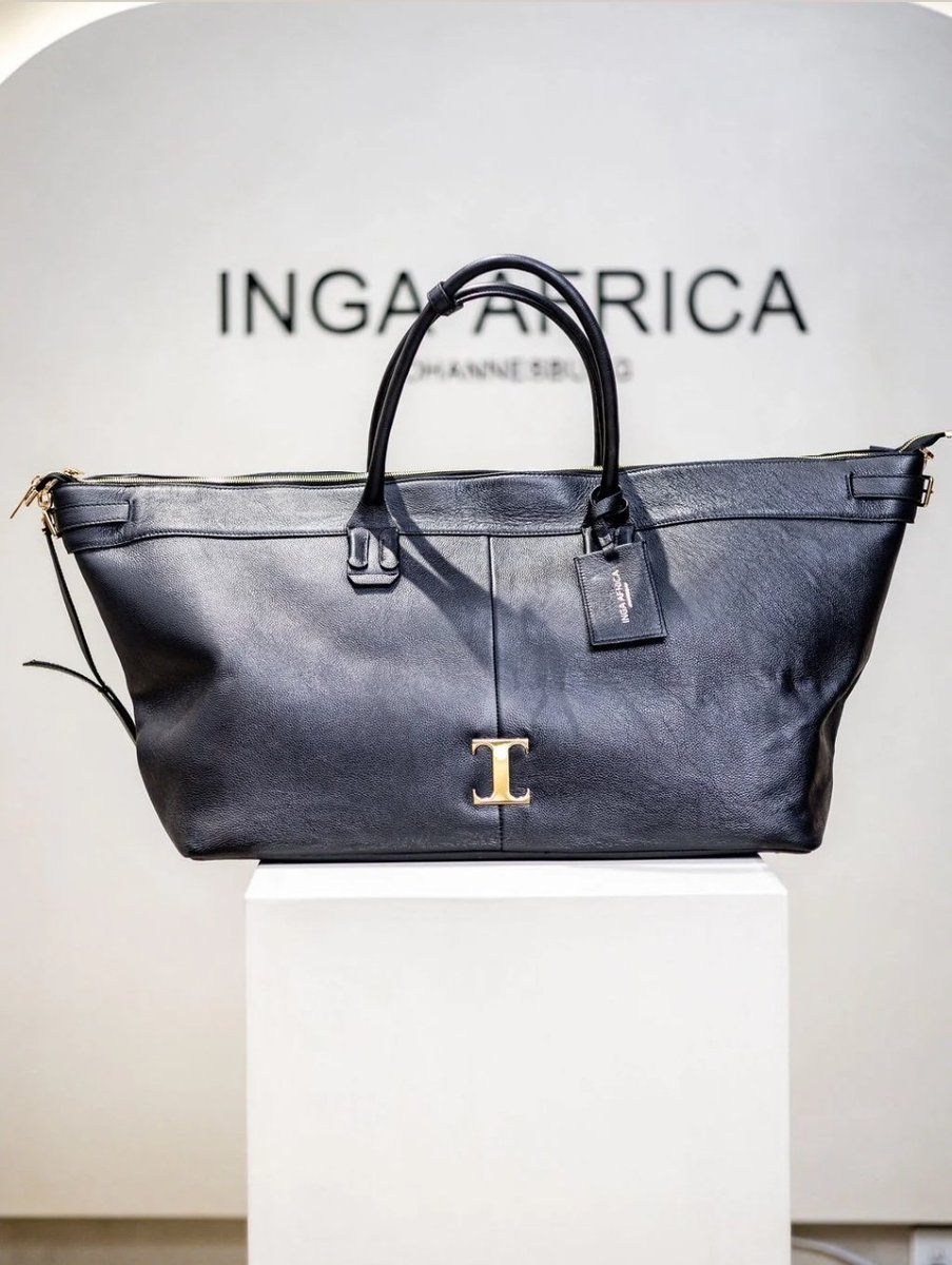 Musa_Khawula's tweet photo. Meet Inga Gubeka (38) who is the founder of Inga Africa previously known as Inga Atalier. 

Inga Gubeka who hails from a small village Engqeleni; Eastern Cape joins the likes of Carol Bouwer in the bag selling business. The only difference is Inga Gubeka's handbags are more refined and ranging from R7000 to R15 000 per item meanwhile Carol Bouwers bags are not just overpriced with prices ranging from R30 000 to R60 000 per bag and these underwhelming bags are also a disgrace to society.