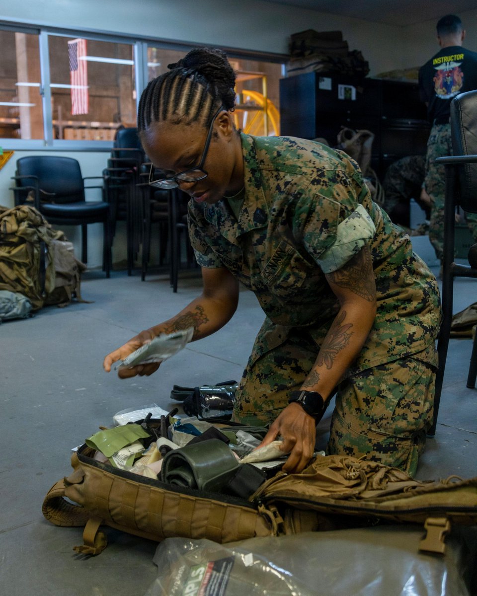 IIIMEF's tweet photo. U.S. Navy Hospital Corpsman 2nd Class Willisha Pinson, a sailor with 1st Marine Aircraft Wing, stocks a medical bag during a Tactical Combat Casualty Care Combat Medic/Corpsman course at Marine Corps Air Station Futenma, Okinawa, Japan, June 22, 2026. @1stMAW_Marines https://t.co/zV8ZGym29w