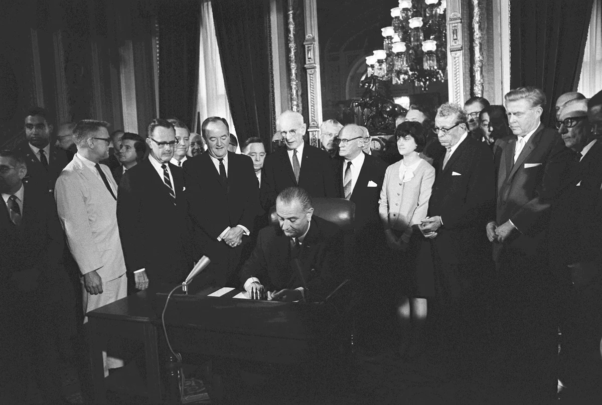 President Lyndon B. Johnson signing the Voting Rights Act of 1965. 