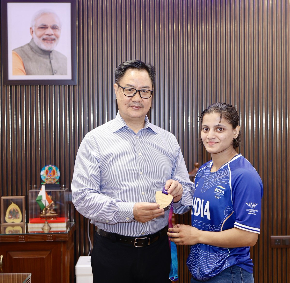 KirenRijiju's tweet photo. I am super proud to receive Asmita Dey, the first Indian to win a Commonwealth Games Gold Medal in Judo. She comes from a humble family in Tripura and serving in Uttar Pradesh Govt.

Congratulated her on her outstanding achievement at the #CWG2026. Her remarkable feat reflects years of dedication, perseverance & hard work &  will inspire countless young judokas across the country. I also congratulated her coach, Shri Yashpal Solanki ji, for his invaluable guidance & contribution to this historic success.

#Cheer4Bharat