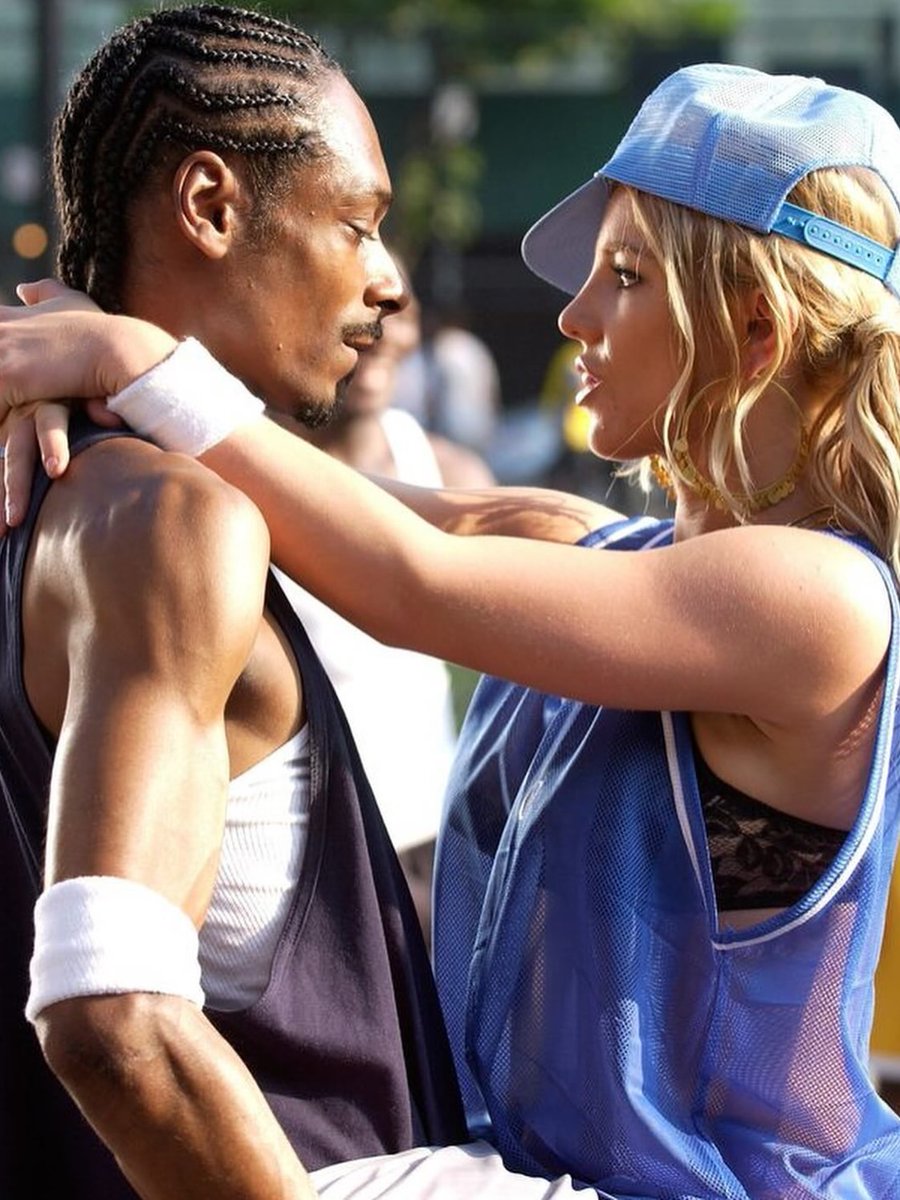 historyinmemes's tweet photo. Britney Spears on the set of her “Outrageous” music video in 2004.

Unfortunately, the project was never completed as originally planned.

After Snoop Dogg finished filming his scenes, Britney Spears suffered a serious knee injury while performing a demanding dance sequence later that night in Manhattan. The injury required surgery, forcing production to shut down before the music video could be fully completed.