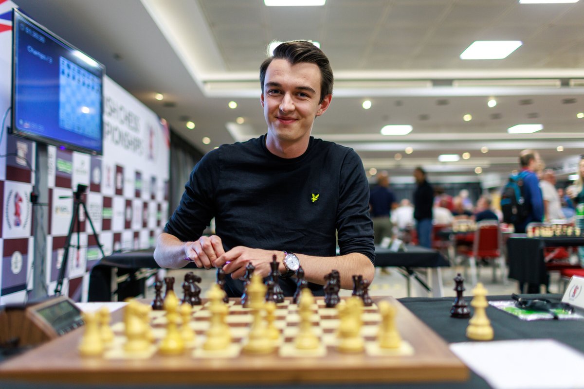 ecfchess's tweet photo. ♟️ Round 6 is LIVE!

After yesterday's marathon queen vs queen-and-pawn win, Michael Adams is back on the live boards, while Bodhana Sivanandan faces Shreyas Royal in another blockbuster pairing.
🎙️ Watch live:
https://t.co/l03oXMKKrM
#BritishChess #BCC2026 #Chess https://t.co/fb0EGYqtqy