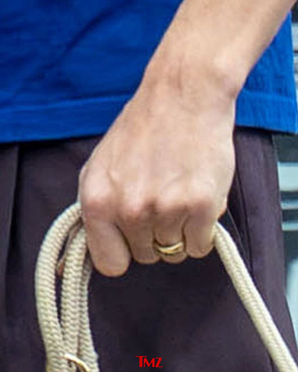 TMZ's tweet photo. 💍 EXCLUSIVE: Tom Holland and Zendaya show off wedding bands on a coffee date in London.

Photos: https://t.co/xtMa4LUkdl

📸: Backgrid https://t.co/SOYxNFrn7S