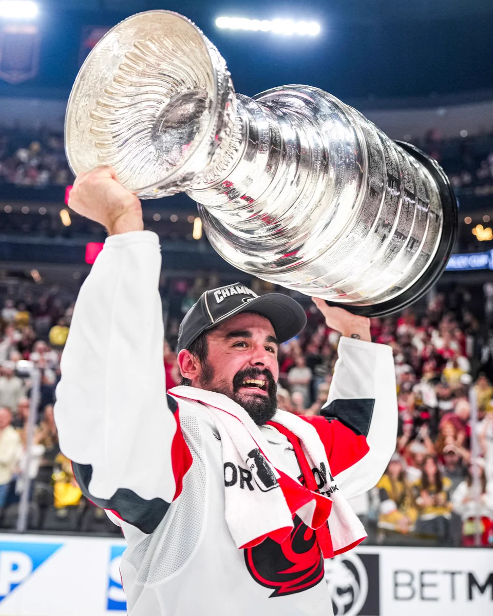 Photo of Jarvy hoisting the Stanley Cup 