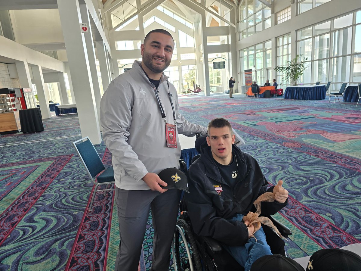 PaulChestnutt's tweet photo. During @seniorbowl Week Saints College Scouting Coord @ziad_qubti was Kind Enough to Give Matty Saints Hats-At Saints Training Camp Matty was Excited to Give Ziad Matty&amp;Dad Bobblehead to Help Promote @BlueWahoosBBall Special Needs Night Sept 11-Thank You Ziad! #SpecialNeedsStrong https://t.co/5jm1ODtXX5
