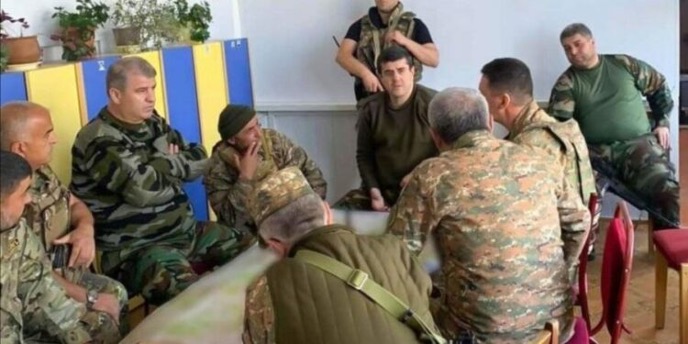 RasulMehdiyev's tweet photo. In the eve of the anniversary of historic Washington meeting I see some activity among armenian diaspora, especially those connected to @ANCA_DC. They demand the release of "armenian POWs". Well, let's see why imprisoned armenian citizens can not be considered as POW (prisoners of war) according to Geneva Conventions:

- The old self‑proclaimed “Nagorno‑Karabakh Republic” lacked recognition from international actors, so its detachments cannot be the armed forces of a Party.
- Since the armenian armed forces in the Karabakh region that were fighting against Azerbaijan proclaimed themselves a state military army, they can't enjoy the expansion of "members of militias or volunteer corps". 
-  Breaching Article 4(2) of the Third Geneva Convention. The photo was taken during 2020 war in a kindergarten used as a military command center. In the photo are military commanders (Arayik Harutyunyan chairing) of self-proclaimed “Nagorno-Karabakh Republic”. As seen in the photo there is no visible flag or insignia, or rank on uniforms. Also, usage of civil structures for military purposes is violation of Geneva Convention.
- Charges against the prisoners include terrorism financing, intentional murder, aggressive war and the 2020 missile strikes on Ganja that killed 31 civilians. Such acts strip any combatant privilege.
- Second photo displays Vardanyan’s capture by State Border Security of Azerbaijan. He was captured while trying to flee Azerbaijan illegally. He was not captured during war or any active combat environment.