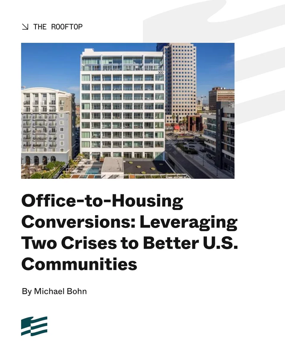 The image shows a publication featuring an article titled "Office-to-Housing Conversions: Leveraging Two Crises to Better U.S. Communities" by Michael Bohn. It includes a photo of a modern multi-story building among other tall structures in an urban area.