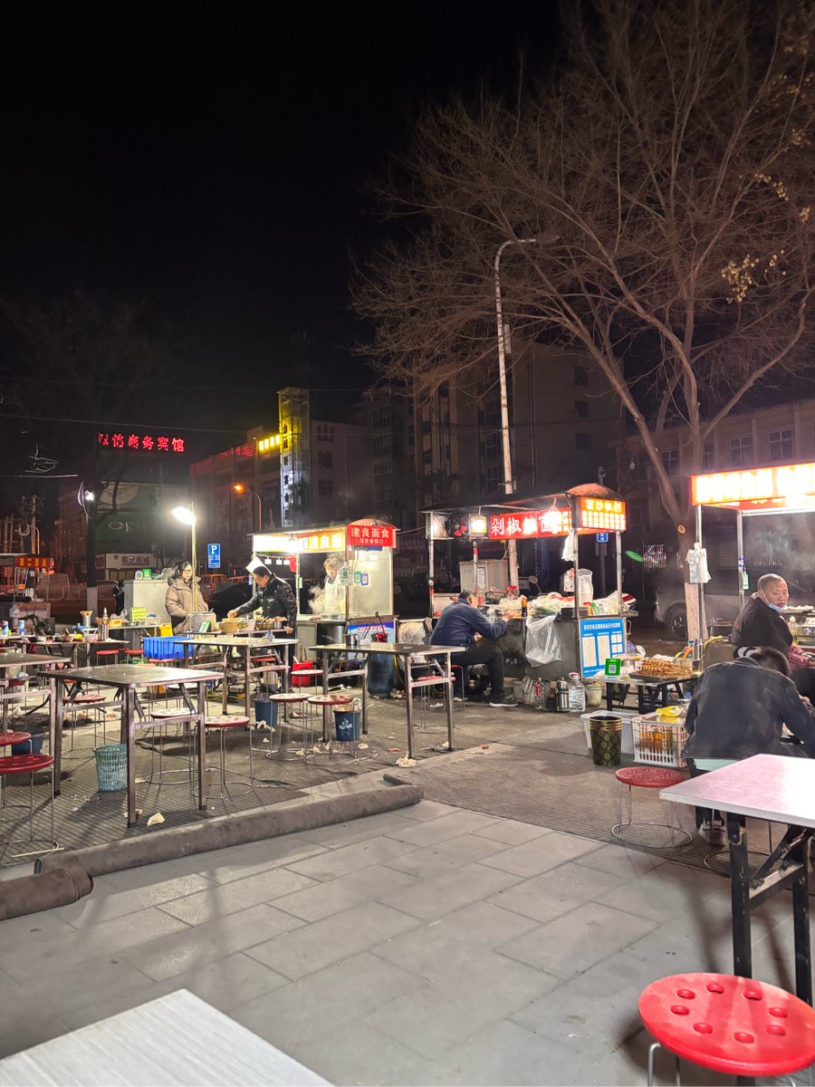 RyanStorey20's tweet photo. Late-night bites: warm ramen, soft steamed buns, and stories only a 24h food stall’s neon lights listen to. https://t.co/y3qp85qOI5