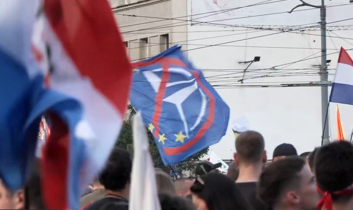 suedostX's tweet photo. Perhaps this reminder was not needed after all. At the Slavija protests in May 2026, this flag carried a clear message: no EU, no NATO. It did not speak for everyone — but the number of EU flags I saw was exactly zero. https://t.co/KaQTFkRoWF