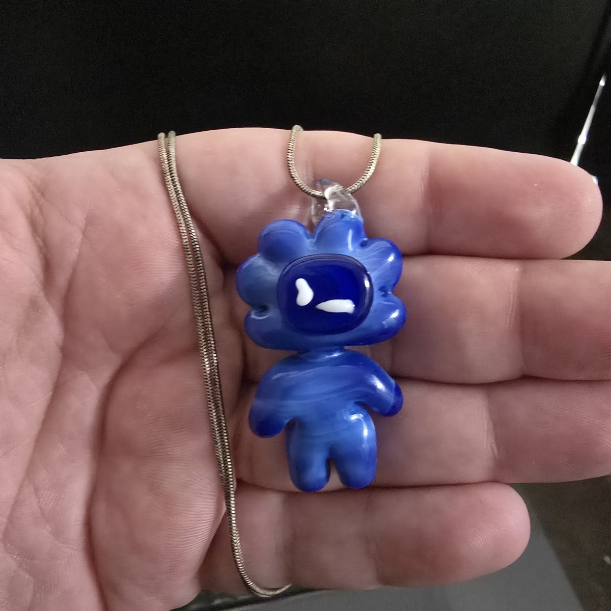 cdenczek's tweet photo. I made Codex into a pendant 🤓
A little different from writing code. I made this pendant with fire and borosilicate glass 🔥 I might make more. It was a fun idea. #lampworking #codex #chatgpt https://t.co/AxjjK43ILy