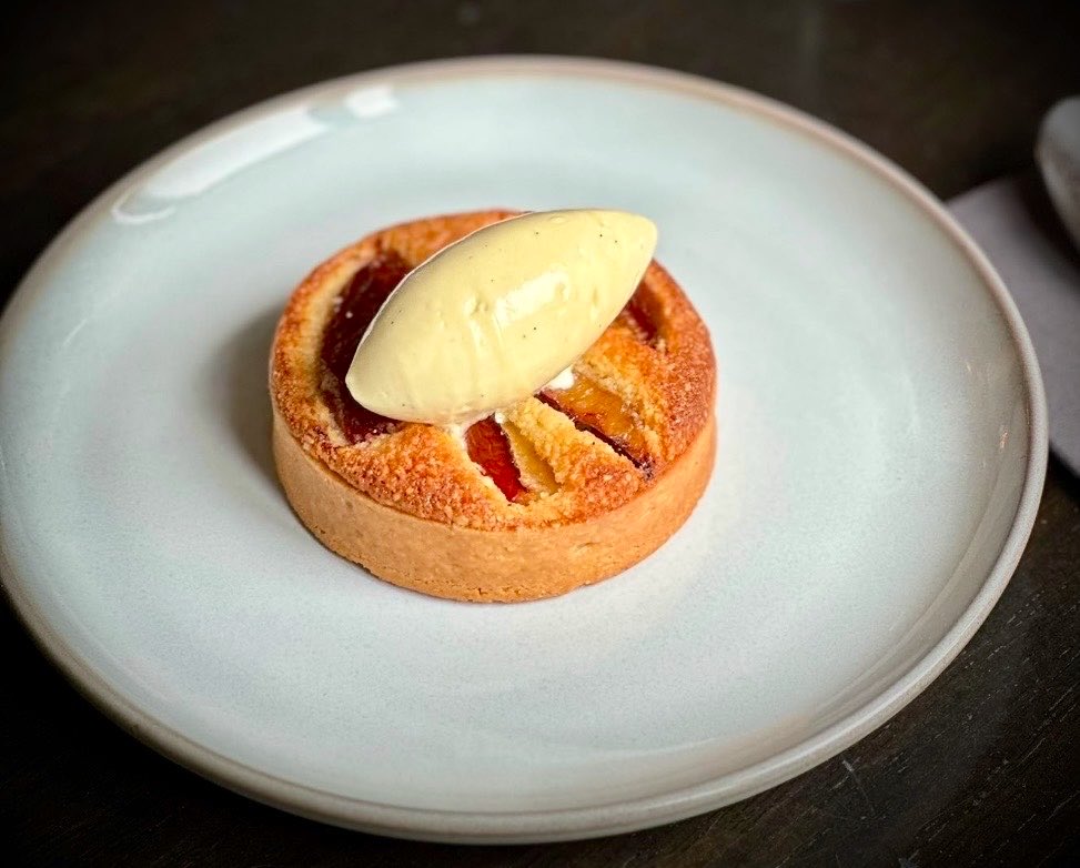 squarebistro's tweet photo. A friend & customer brought some fabulous home grown plums from his allotment and the chefs turned them into a fabulous plum tart with white chocolate & almond cremeux…. #properchefs #cheflife @chefJcrozier @weejamierea https://t.co/CFXBQwJwSg