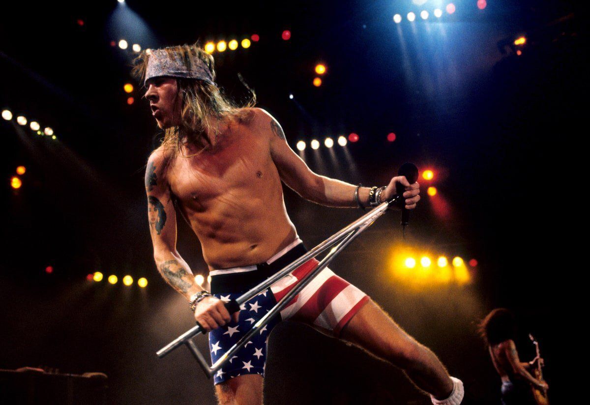 crockpics's tweet photo. Axl Rose of Guns N' Roses tearing up the stage at Wembley Stadium in London back on August 31, 1991. Taken during their legendary Use Your Illusion Tour right before the double album dropped, this image captures Axl in his iconic American flag shorts and bandana commanding over 70,000 fans. Photo by Kevin Mazur.

DId you ever see Guns N' Roses in concert?