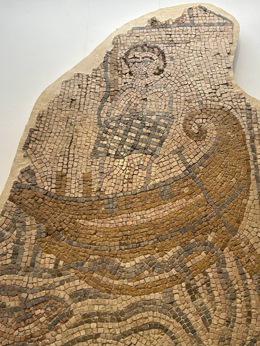 Nadav_Eyal's tweet photo. Odysseus, in Eretz Yisrael. A section of a 1,500-year-old mosaic discovered in Israel in 1964, in the Beit She’an area. This panel shows the famous scene of Odysseus bound to the mast of his ship, looking to the left, toward what was probably a Siren. Below him, a sailor faces another Siren playing a flute.

The house belonged to a prominent Jewish man, Leontis Kloubas, as indicated by the dedication, which includes the symbol of the Jewish menorah. The entire mosaic was eight meters long, and another section depicted the god of the Nile.

It is fascinating to see just how cosmopolitan Jewish life in Eretz Yisrael was 1,500 years ago- with Greek mythology, pagan imagery, and Jewish identity all appearing within the same work of art. I read about this on Dr. Pnina Arad page.
