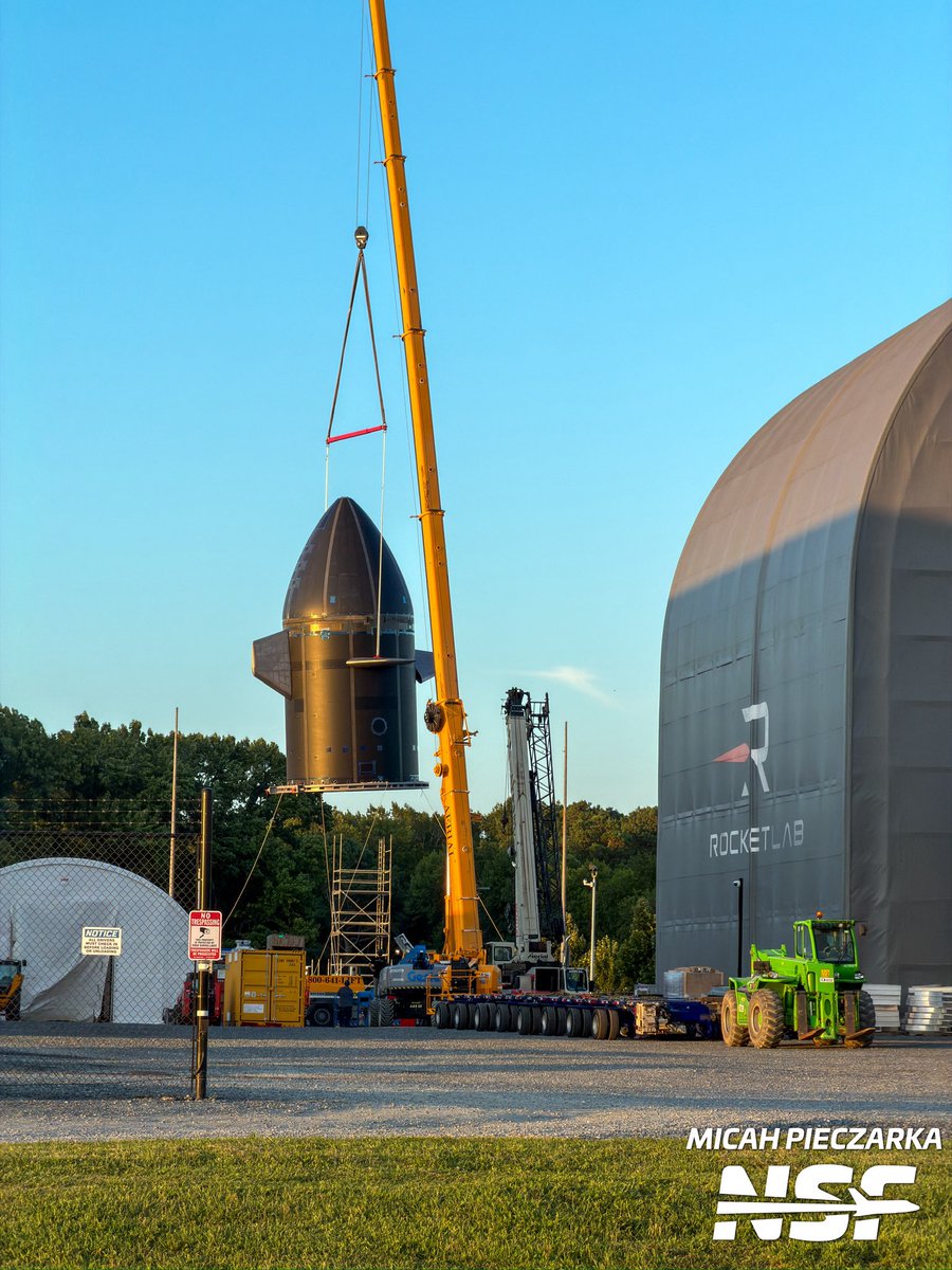 EShoreSpaceflt's tweet photo. Rocket Lab Neutron AIC, the hungry hippo, is airborne, at least crane-assisted. The lift is currently underway and they're putting it over the scaffolding as suspected. More pictures and video to come later 

@NASASpaceflight https://t.co/gBB6t604YA