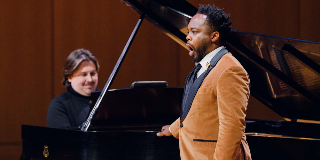 WheatonCollege's tweet photo. In February, acclaimed baritone Will Liverman ’10 and pianist Jonathan King ’10 returned to Wheaton to perform an Artist Series concert, where they performed a repertoire that elicited roaring applause from the audience. Read about the electric night: https://t.co/yTqMTJBCE6 https://t.co/Zbzr1TTnil