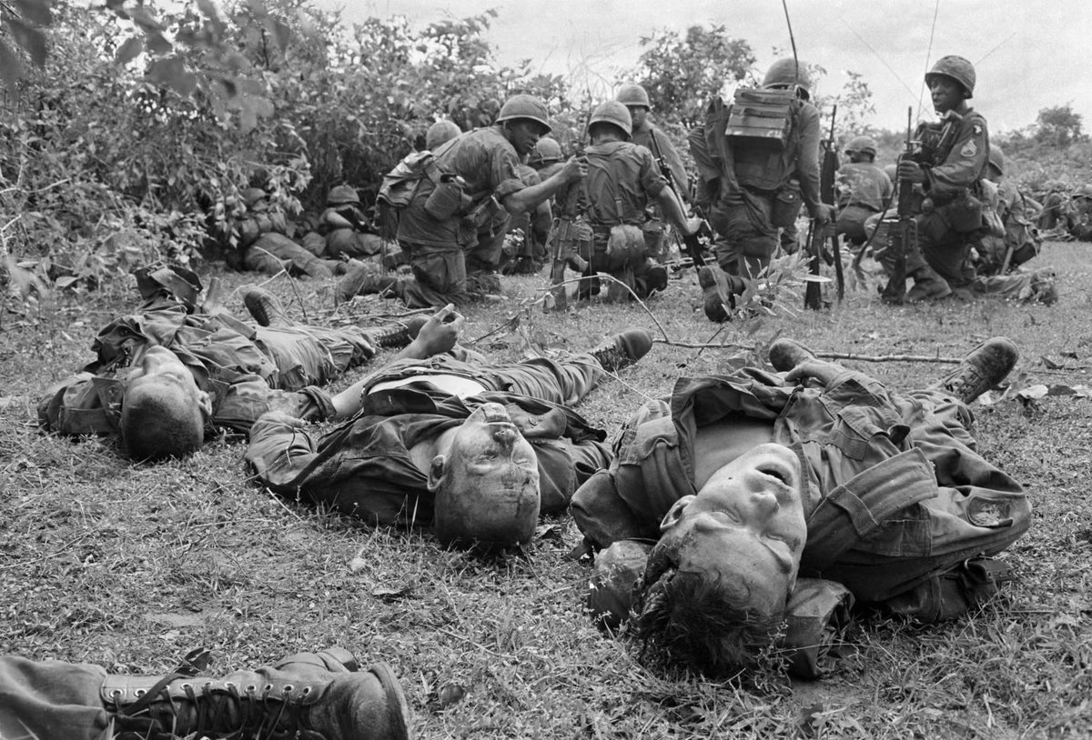 VoicesfromNam's tweet photo. Bodies of US paratroopers lie near a command post during the battle of An Ninh, 18 September 1965. The paratroopers, of the 1st Brigade, 101st Airborne Division, were hit by heavy fire from guerrillas that began as soon as the first elements of the unit landed. The dead and wounded were later evacuated to An Khe, where the 101st was based. The battle was one of the first of the war between major units of US forces and the Vietcong