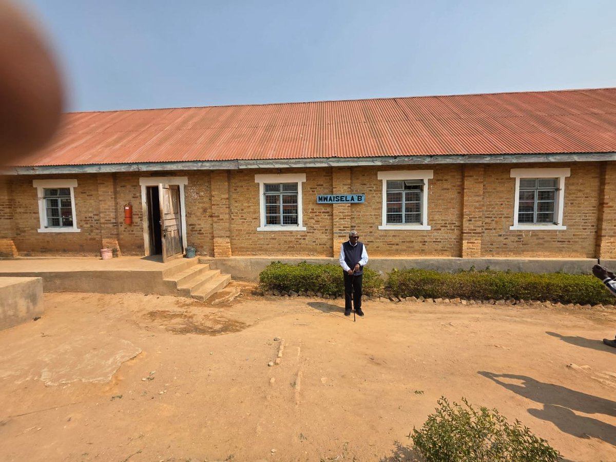 MarkMwandosya's tweet photo. Wednesday 5 August 2026, my wife Lucy Akiiki, and I visited my alma mater, Malangali Secondary School. I was there 1965-1968, Form I to Form IV.
Pic1, At the signage; Pic2, with Headmater Mwaluke and Board chair Shirima; Pic3, my Form 1 class behind; Pic4 my dormitory Mwaisela B. https://t.co/HXwEBYyJ8Y