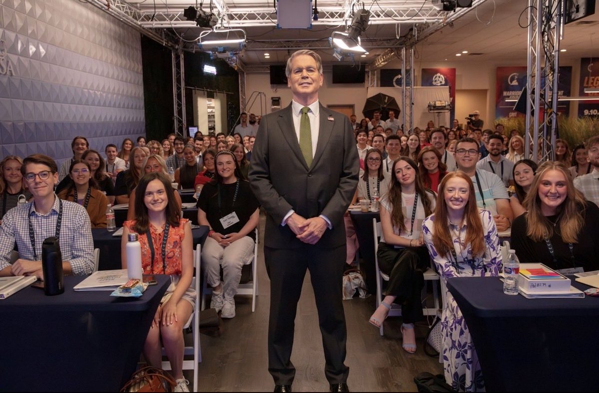 ReaganM2332's tweet photo. WHAT AN HONOR!! 

TPUSA had the @SecScottBessent come speak to the 150+ new hires! We are so ready to fight to save America. 🇺🇸🇺🇸

@TPUSA | @tpusastudents https://t.co/LBCcsT8WIE