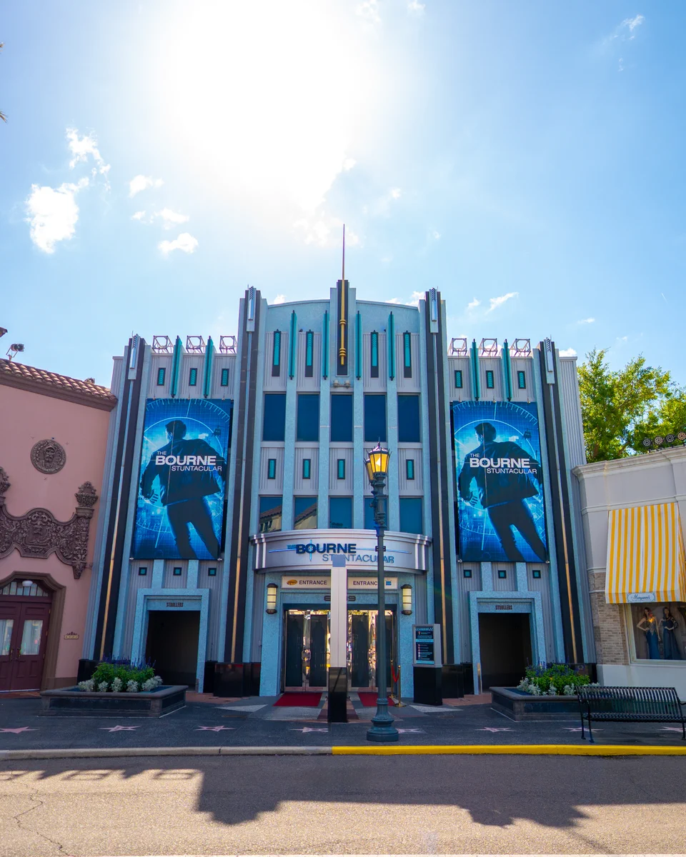 The exterior of The Bourne Stuntacular with its blue, human silhoutte signage.