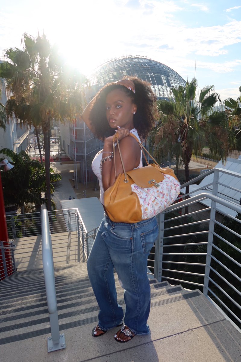 GUACAWOLE's tweet photo. Me too!! I be hype when she wears it cause it was one of her gifts last Christmas. 2008 LV x Richard Prince almost 20 years old &amp; I found one in mint condition. I love its shape, reminds me of a croissant 🥐 https://t.co/y2bIWbi0MT