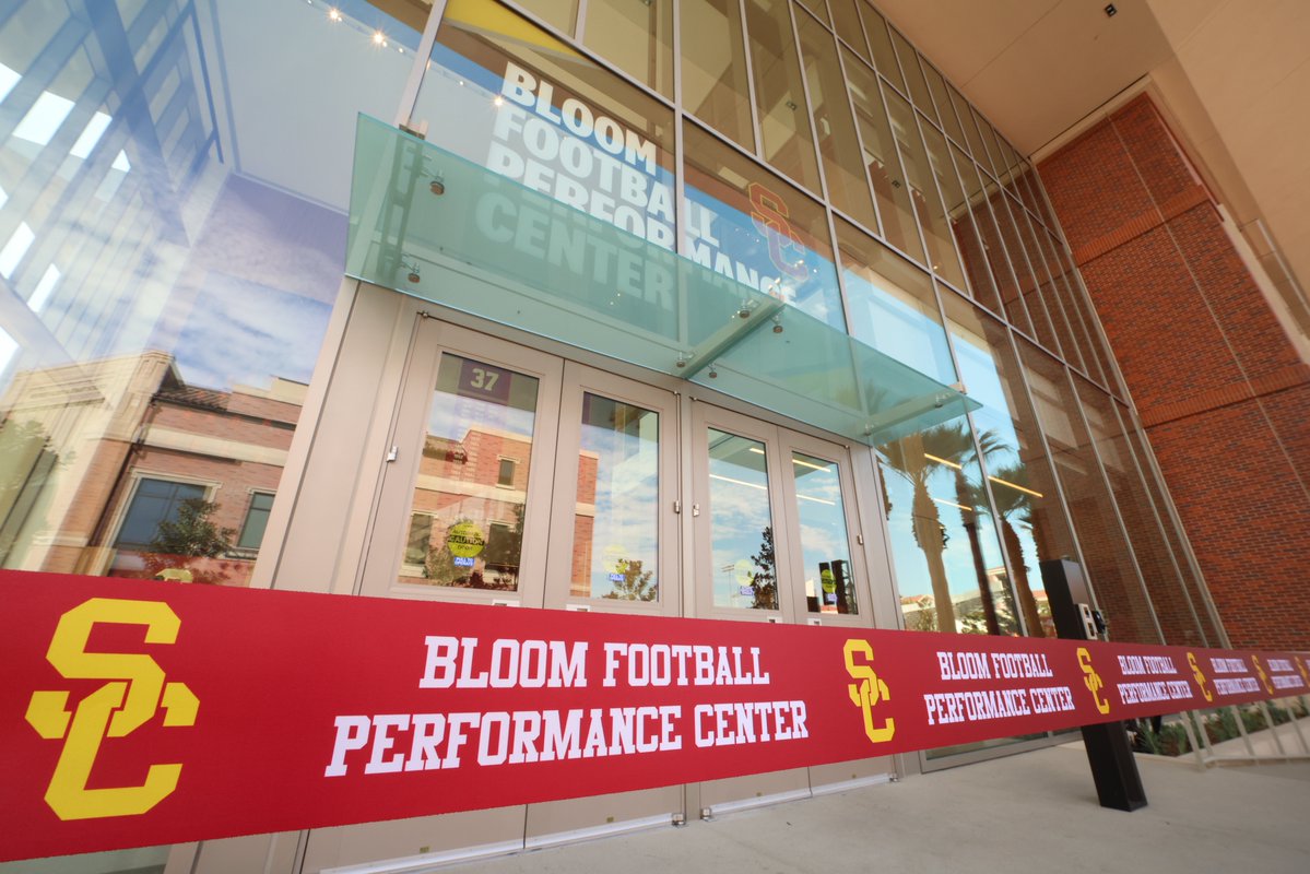 USC's tweet photo. The state-of-the-art Bloom Football Performance Center has opened as the new home of USC football. Designed to support every aspect of the student-athlete experience, the center provides more resources, spaces and technology to help Trojans train, grow and build community. Learn more about how the Bloom Football Performance Center honors USC football’s legacy while shaping its future: https://t.co/qDoShY9RA9