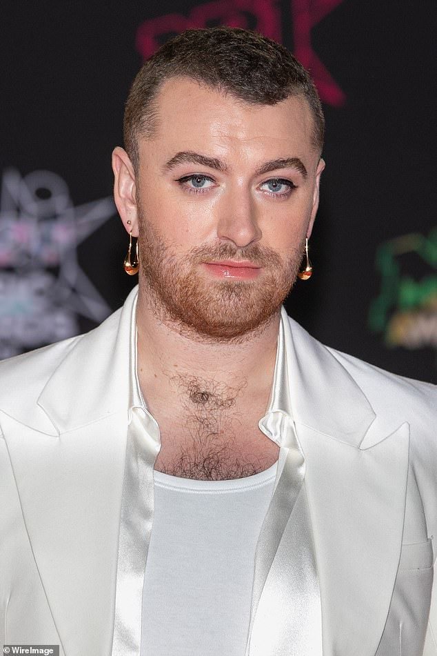 Emmy_jay231's tweet photo. Sam Smith looks chic in a silk blazer and wide-legged trousers as they step out at the NRJ Music Awards in Cannes https://t.co/GbmSuXpo4D