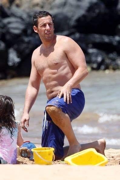 HealthTips62433's tweet photo. Adam Sandler spotted showing off his unique tummy physique while catching some waves at the beach. https://t.co/msh2BCyIQ7