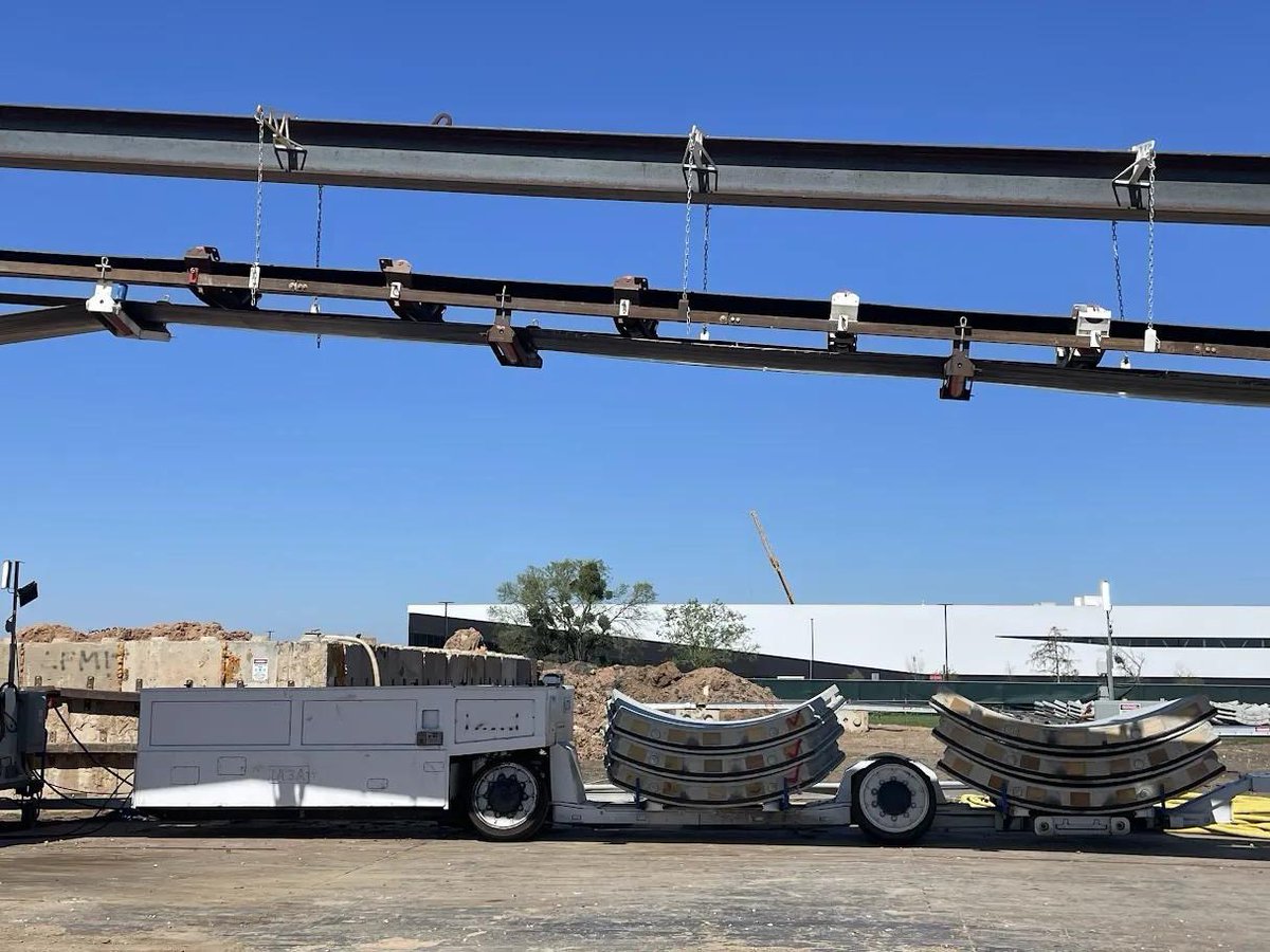 boringcompany's tweet photo. Introducing Liner Truck 3 — our latest fully electric tunnel vehicle. 

- Tesla Model 3 battery and drive units
- Transports 22,000+ lb of concrete segments to the boring machine
- 28 miles of range
- 12 mph max operating speed
- Remotely piloted from Global OCC in Texas, with each pilot controlling/monitoring > 8 LTs in the field. 

Fun fact: the same Liner Truck can carry standard freight containers through the tunnel.