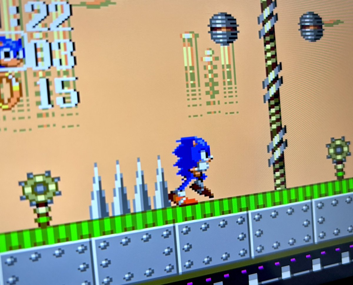 HatStackMike's tweet photo. Mecha Green Hill Zone from Sonic Chaos is such a cool concept. It’s Green Hill again without being “just Green Hill again”. There are bombs hiding in fake mechanical trees, tilted metal platforms to run across, and it’s just an awesome twist on a familiar trope. https://t.co/CtzgeN7Ylb