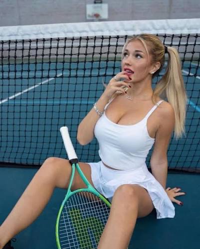 DailyBreckie's tweet photo. White tennis fit hugging every curve 😈… racket in hand but we both know what’s really winning 💋 https://t.co/gQBJ3VvF0a