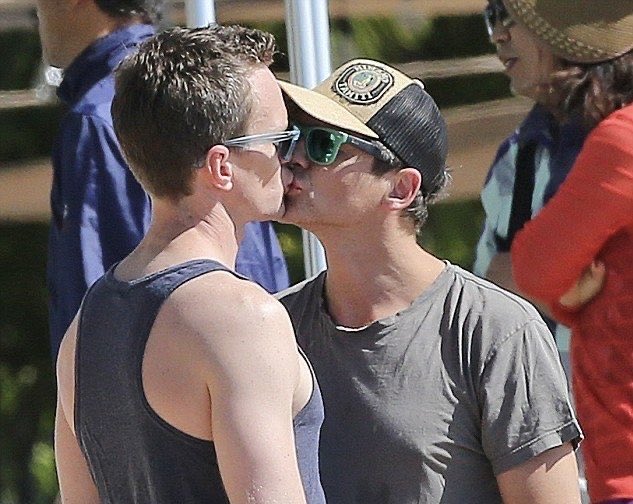 SceneOrbit's tweet photo. Neil Patrick Harris and husband David share a sweet beach kiss. ❤️ Throwback. https://t.co/bmAqEcjK6X