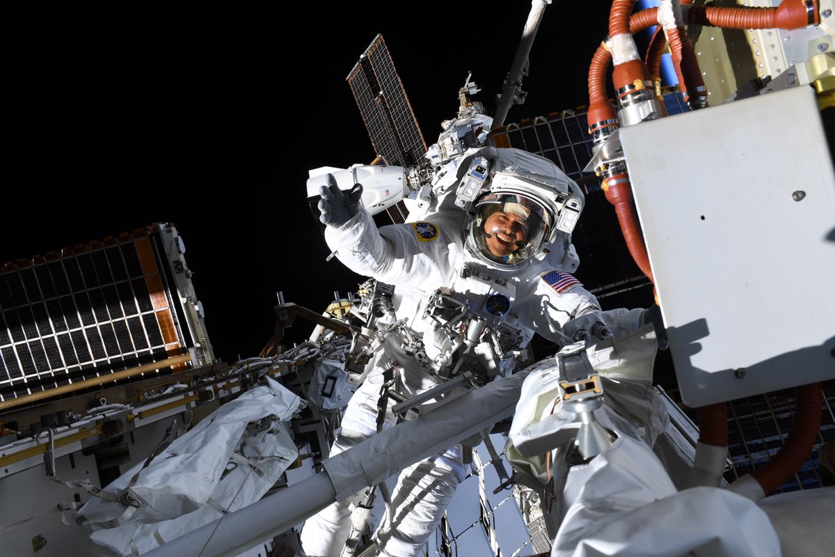Astro_Jessica's tweet photo. That first spacewalk feeling!  Congratulations to @astro_anil on his first spacewalk.  Mission complete as we assembled the last of the mounting brackets that will hold another set of solar arrays to augment the @Space_Station  power supply. https://t.co/zItZqBSesR